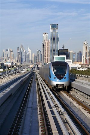 Skyline and Dubai Metro, Modern Elevated Metro system, opened in 2010, Dubai, United Arab Emirates, Middle East Stock Photo - Rights-Managed, Code: 841-03674932