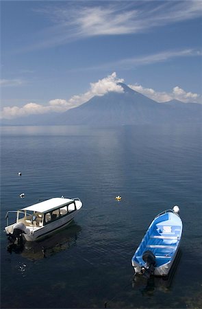 Tour boats anchored near Panajachel, San Pedro Volcano in the background, Lake Atitlan, Guatemala, Central America Stock Photo - Rights-Managed, Code: 841-03675322