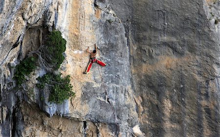 A man on a long and technically demanding face climb on the limestone cliffs of the Mascun Canyon, Rodellar, Sierra de Guara, Aragon, southern Pyrenees, Spain, Europe Foto de stock - Con derechos protegidos, Código: 841-03675361