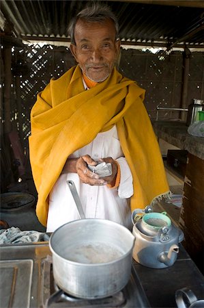 Village chai wallah (teamaker) makes the first brew of the day, Kurua village, Assam, India, Asia Stock Photo - Rights-Managed, Code: 841-03675428