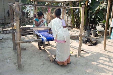 Two women weaving at household loom, Ganeshpahar village, Brahmaputra, Assam, India, Asia Stock Photo - Rights-Managed, Code: 841-03675439