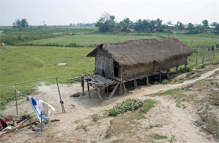 exterior house pictures in india - Mishing tribal village house, Majuli Island, largest freshwater riverine island in the world, in the Brahmaputra River, Assam, India, Asia Stock Photo - Rights-Managed, Code: 841-03675443