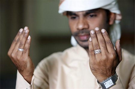 dubai sign - Muslim man praying, Dubai, United Arab Emirates, Middle East Stock Photo - Rights-Managed, Code: 841-03675905