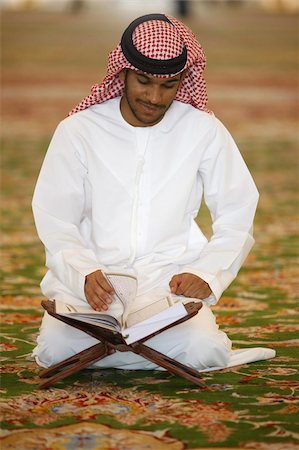 Muslim man reading the Koran, Sheikh Zayed Grand Mosque, Abu Dhabi, United Arab Emirates, Middle East Stock Photo - Rights-Managed, Code: 841-03675915