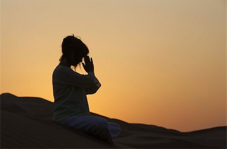 praying - Sunset meditation in the desert, Abu Dhabi, United Arab Emirates, Middle East Stock Photo - Rights-Managed, Code: 841-03675934