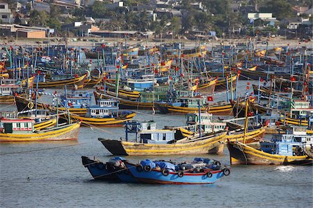 Fishing boats in Mui Ne harbor, Mui Ne, Bin Thuan, Vietnam, Indochina, Southeast Asia, Asia Fotografie stock - Rights-Managed, Codice: 841-03675984