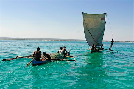 Traditional sailing boat and rowing boat in the turquoise water of the Indian Ocean, Madagascar, Africa Stock Photo - Rights-Managed, Code: 841-03676730