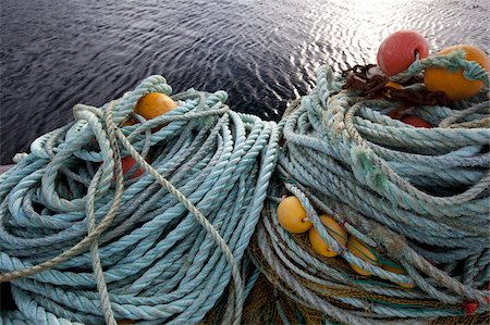 Ropes, fishing nets and floats on the quay in the harbour of Sto village, island of Langoya, Vesteralen archipelago, Troms Nordland county, Norway, Scandinavia, Europe Fotografie stock - Rights-Managed, Codice: 841-03676879