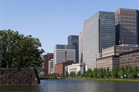 simsearch:841-02705987,k - Modern high-rise office buildings lining the old Edo Castle moat in the Marunouchi district of Tokyo, Japan, Asia Stock Photo - Rights-Managed, Code: 841-03676973