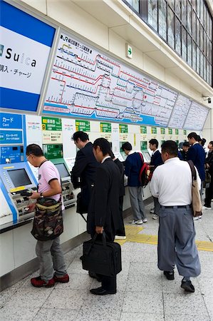 Passengers purchasing train tickets from vending machines at the JR Ueno railway station in Tokyo, Japan, Asia Stock Photo - Rights-Managed, Code: 841-03676983