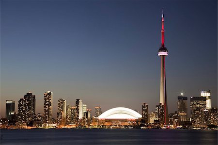 Skyline of city with CN Tower and Rogers Centre, previously The Skydome, Toronto, Ontario, Canada, North America Stock Photo - Rights-Managed, Code: 841-03677093