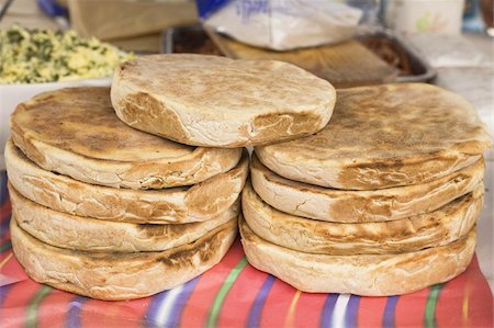 Traditional Madeiran flat bread is cooked and served at a stall in Funchal, Madeira, Portugal, Europe Stock Photo - Rights-Managed, Code: 841-03677207