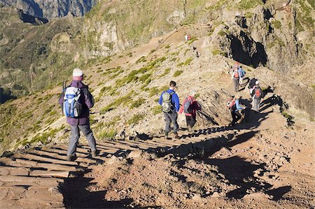 portugal tourist places - Hikers walk on on a footpath on the Pico do Ariero on the island of Madeira, Portugal, Europe Stock Photo - Rights-Managed, Code: 841-03677202