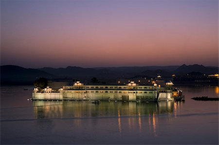 Elevated view of the Lake Palace Hotel on Lake Pichola at dusk, Udaipur, Rajasthan, India, Asia Stock Photo - Rights-Managed, Code: 841-03672196