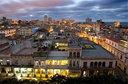 simsearch:841-03517077,k - View over Havana Centro at night from 7th floor of Hotel Seville showing contrast of old, semi-derelict apartment buildings against a backdrop of more modern, affluent architecture, Havana, Cuba, West Indies, Central America Stock Photo - Rights-Managed, Code: 841-03672438