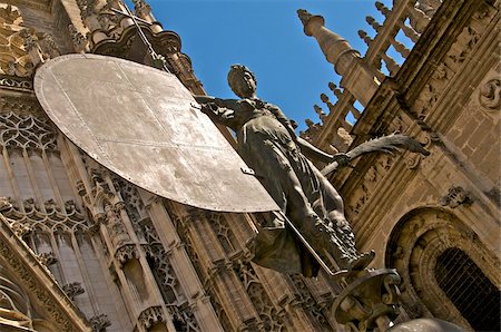 seville spain cathedral - The Giralda, reproduction of the famous weather vane of the Victorious Faith statue with the Cathedral in the background, UNESCO World Heritage Site, Seville, Andalusia, Spain, Europe Stock Photo - Rights-Managed, Code: 841-03672629