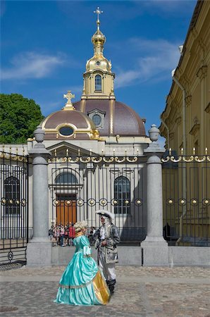 people in russia - Two people in period dress by the Cathedral, Peter and Paul Fortress, St. Petersburg, Russia, Europe Stock Photo - Rights-Managed, Code: 841-03673900