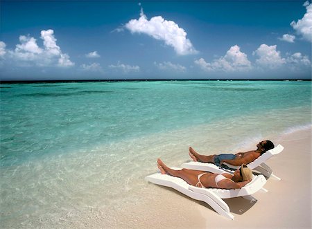 Couple à bronzer sur une plage, Maldives, océan Indien, Asie Photographie de stock - Rights-Managed, Code: 841-03867914