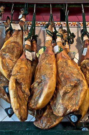 Spanish hams hanging in a restaurant bodega, Seville, Andalusia, Spain, Europe Stock Photo - Rights-Managed, Code: 841-03868094