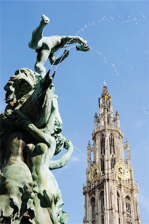 european clock - Tower of Onze Lieve Vrouwekathedraal and the baroque Brabo fountain, Grote Markt, Antwerp, Flanders, Belgium, Europe Stock Photo - Rights-Managed, Code: 841-03868360