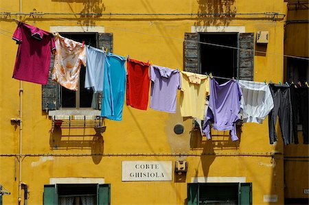 Clothes hanging on a washing line between houses, Venice, UNESCO World Heritage Site, Veneto, Italy, Europe Stock Photo - Rights-Managed, Code: 841-03869715