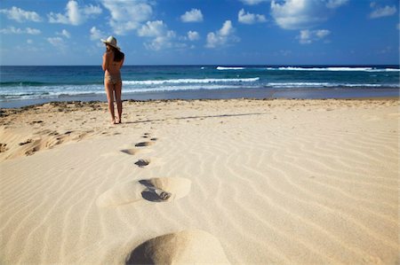 Woman standing on sand dunes, Tofo, Inhambane, Mozambique, Africa Stock Photo - Rights-Managed, Code: 841-03870135