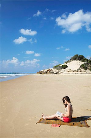 Woman reading on beach, Tofo, Inhambane, Mozambique, Africa Stock Photo - Rights-Managed, Code: 841-03870132