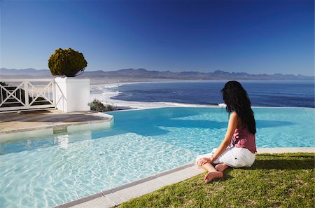 simsearch:841-05796387,k - Woman relaxing poolside at Plettenberg Bay Hotel, Plettenberg Bay, Western Cape, South Africa, Africa Stock Photo - Rights-Managed, Code: 841-03870154