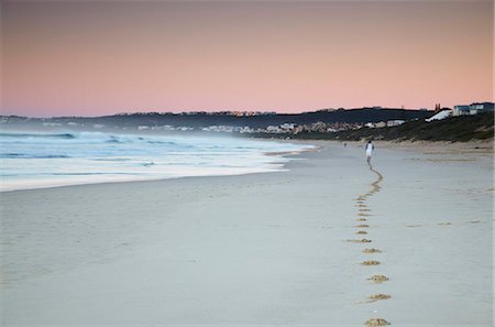 sunrise with sand - Man jogging on beach at dawn, Plettenberg Bay, Western Cape, South Africa, Africa Stock Photo - Rights-Managed, Code: 841-03870155