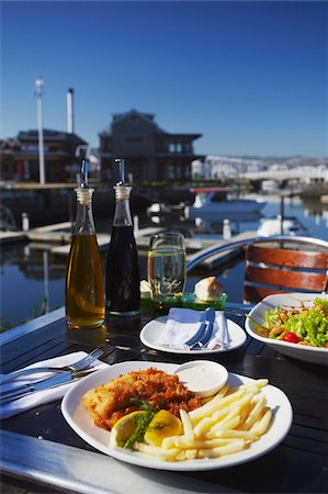 Fish and chips at outdoor restaurant, Thesen's Island, Knysna, Western Cape, South Africa, Africa Stock Photo - Rights-Managed, Code: 841-03870160