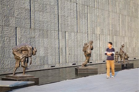 Man walking past statues at Memorial for the Nanjing Massacre, Nanjing, Jiangsu, China, Asia Stock Photo - Rights-Managed, Code: 841-03870193