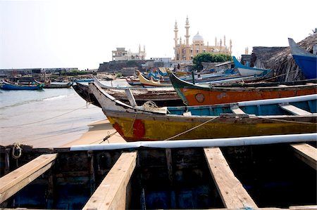 Fishing boats with a mosque in the background, Vizhinjam, Trivandrum, Kerala, India, Asia Stock Photo - Rights-Managed, Code: 841-03870214