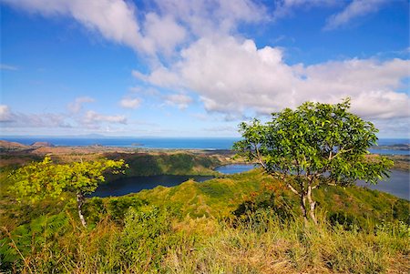 Volcanic lake and the coast of Nosy Be from Mont Passot, Madagascar, Indian Ocean, Africa Stock Photo - Rights-Managed, Code: 841-03870819