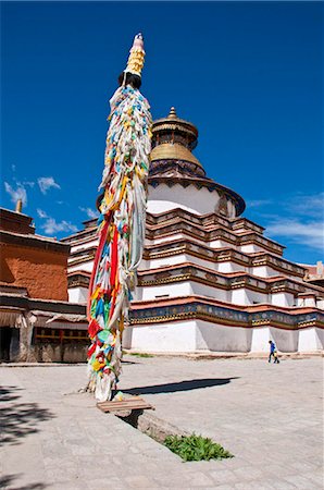 prayer flag - Magnificent tiered Kumbum, literally one hundred thousand images, of the Palcho Monastery, the largest chorten in Tibet, Gyantse, Tibet, China, Asia Stock Photo - Rights-Managed, Code: 841-03870941