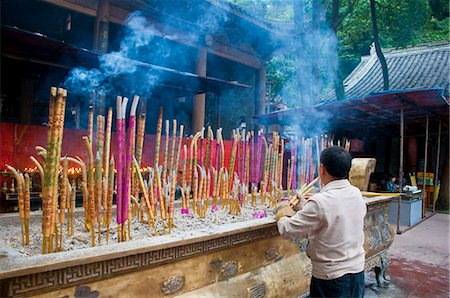 Burning sticks of Tibetan incense in a monastery above the giant Buddha of Leshan, Sichuan, China, Asia Stock Photo - Rights-Managed, Code: 841-03870966