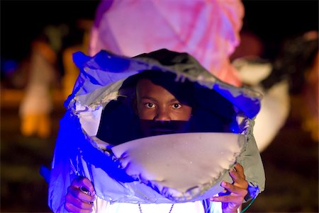 Young boy looking through his giant mask at the Festival of the Creoles, Fete de Creoles, Mahe, Seychelles, Africa Foto de stock - Con derechos protegidos, Código: 841-03871136