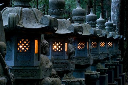 Row of lighted stone lanterns in the Okunoin Temple cemetery at Koyasan (Mount Koya), Wakayama, Japan, Asia Stock Photo - Rights-Managed, Code: 841-03871384