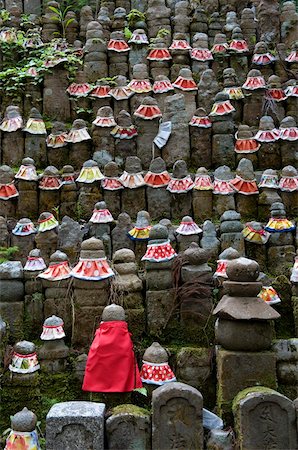 Stone jizo statues with red aprons in the Okunoin Temple cemetery at Koyasan (Mount Koya), Wakayama, Japan, Asia Stock Photo - Rights-Managed, Code: 841-03871385