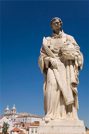 simsearch:841-03867817,k - The statue of St. Vincente cradles a ship, in front of the roofs of the Alfama District, Lisbon, Portugal, Europe Stock Photo - Rights-Managed, Code: 841-03871398