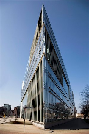 The angular glass fronted modern architecture designed by Hadi Teherani, of the Deichtor Center building, Hamburg, Germany, Europe Stock Photo - Rights-Managed, Code: 841-03871393