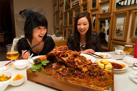 Tourists surprised by the food in a Sichuan cuisine restaurant, Haiyongxiang District, Shanghai, China, Asia Stock Photo - Rights-Managed, Code: 841-03871469