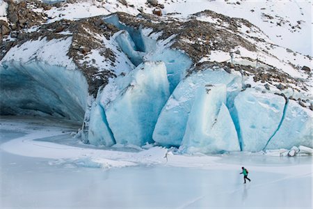 seasonal lake - Woman ice skating in front of Saddlebag Glacier, Chugach Mountains near Cordova, Southcentral Alaska, Winter Stock Photo - Rights-Managed, Code: 854-05974495