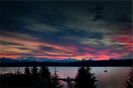 parco nazionale della baia del ghiacciaio - Fairweather Mountains seen from Bartlett Cove at sunset, Glacier Bay National Park & Preserve, Southeast Alaska, Summer Fotografie stock - Rights-Managed, Codice: 854-05974547