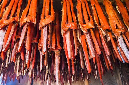 simsearch:854-08028080,k - Strips Of Sockeye Salmon Hanging In A Large Smoker For Drying And Smoking; Igiugig Bristol Bay Alaska United States Of America Foto de stock - Con derechos protegidos, Código: 854-08028080