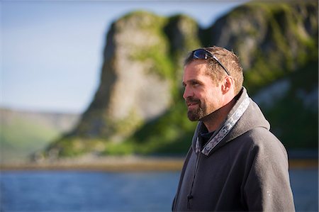 simsearch:854-08028080,k - Portrait Of Buck Laukitis On The Water Near His Family's Fish Camp And Home On The Alaska Peninsula Side Of False Pass, Southwest Alaska, Summer. Foto de stock - Con derechos protegidos, Código: 854-08028163