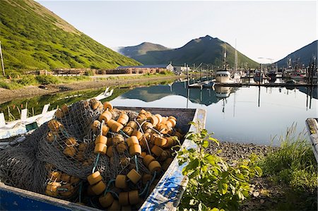 simsearch:854-08028082,k - A Retired Commercial Salmon Fishing Seine Sits In A Dingy Next To The The King Cove Harbor, King Cove, Alaska Peninsula, Southwest Alaska, Summer. Stock Photo - Rights-Managed, Code: 854-08028175