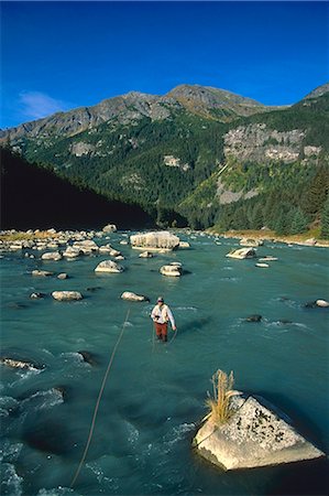 pesca con la mosca - Man Fishing Chilkoot River Haines Southeast Alaska scenic Fotografie stock - Rights-Managed, Codice: 854-02954949