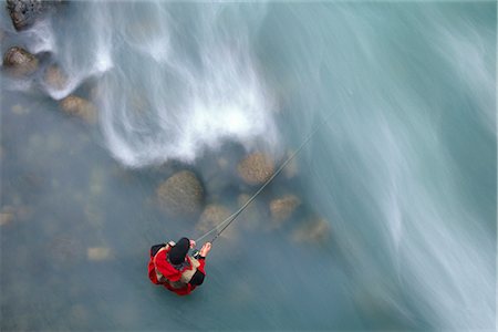 pesca con la mosca - Man Fly Fishing in Little Susitna River Hatcher Pass Fotografie stock - Rights-Managed, Codice: 854-02954978