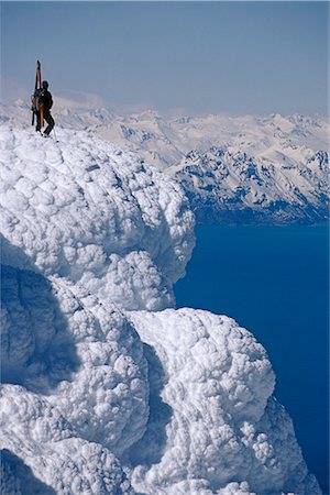 simsearch:854-02954904,k - Mountaineer Standing on ridge viewing vast scenery from Augustine Volcano across Cook Inlet Alaska Stock Photo - Rights-Managed, Code: 854-02955048