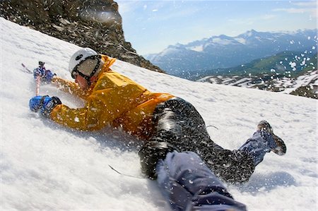 simsearch:854-02954876,k - Young male mountain climber with ice axe in hands practices self arrest on Mount Ascension near Seward Alaska Kenai Peninsula summer Stock Photo - Rights-Managed, Code: 854-02955055
